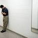 Huron Head Coach Waleed Samaha takes a moment to himself after losing 66-58 to Ypsilanti on Friday, March 8. Daniel Brenner I AnnArbor.com